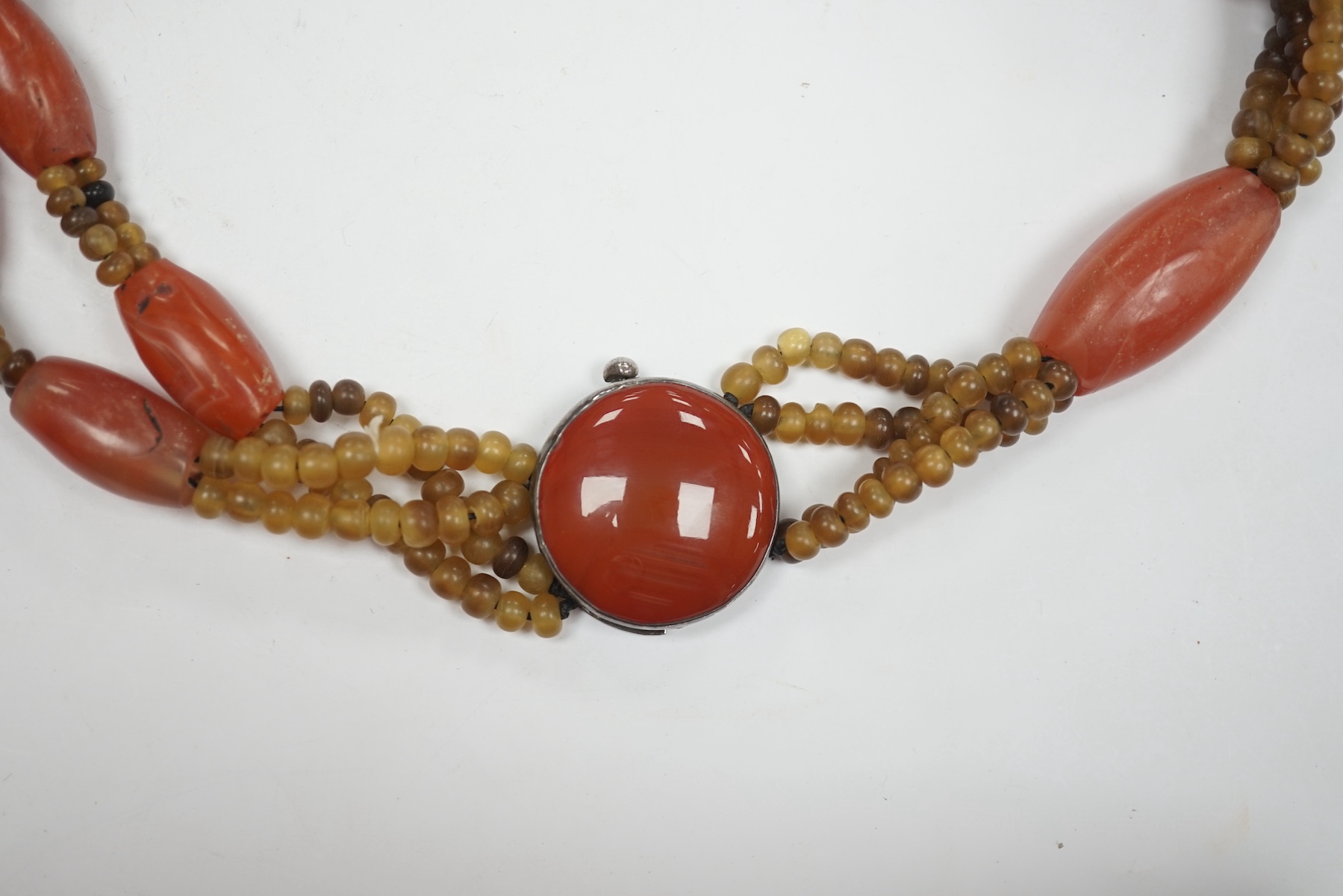 A mid 20th century Chinese chalcedony necklace, with carved pendant and sterling clasp, overall 54cm. Condition - poor to fair